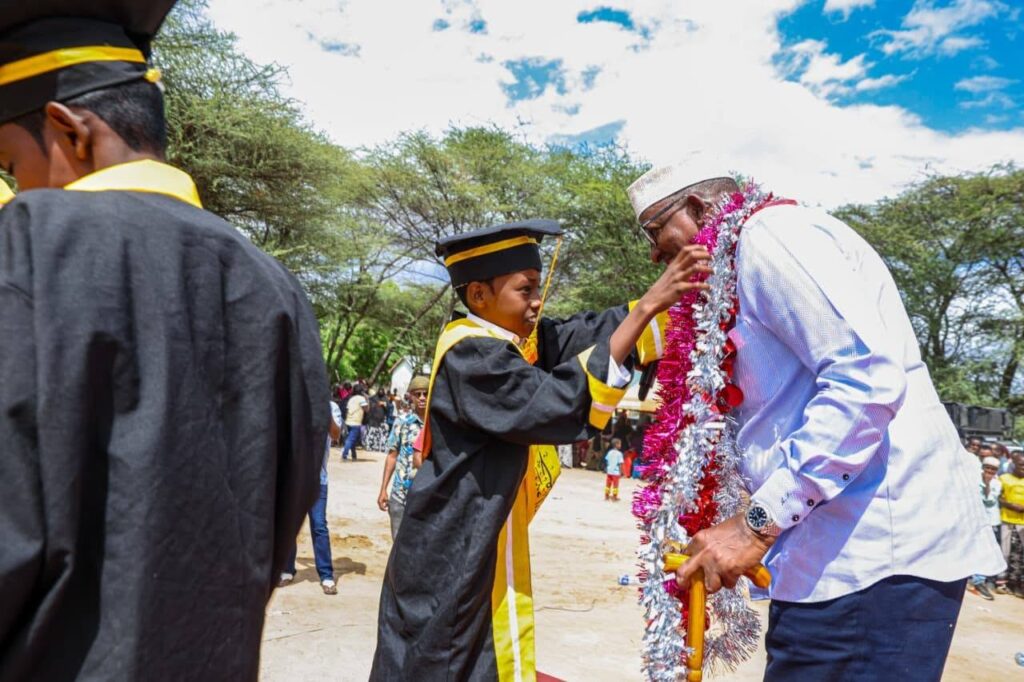 **Madrasa student officially welcomes CS for Health Hon. Aden Duale at the Saka Madrasa graduation ceremony in Garissa. | Asal Post