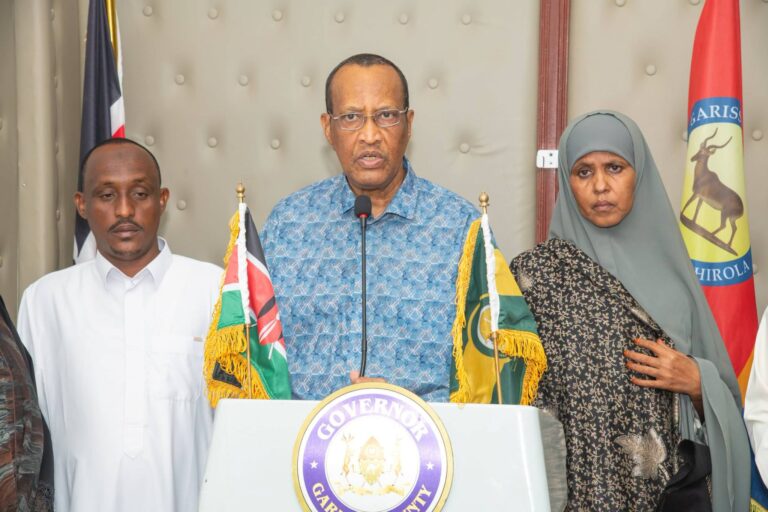 Garissa Governor H.E. Nathif Jama EGH poses for a photo with newly sworn-in Dadaab–Hagadera Municipal Board members Mr. Issa Harun and Ms. Zeinab following their official assumption of office during the board’s inauguration ceremony held at the Garissa County Headquarters. Photo: Handout | Asal Post