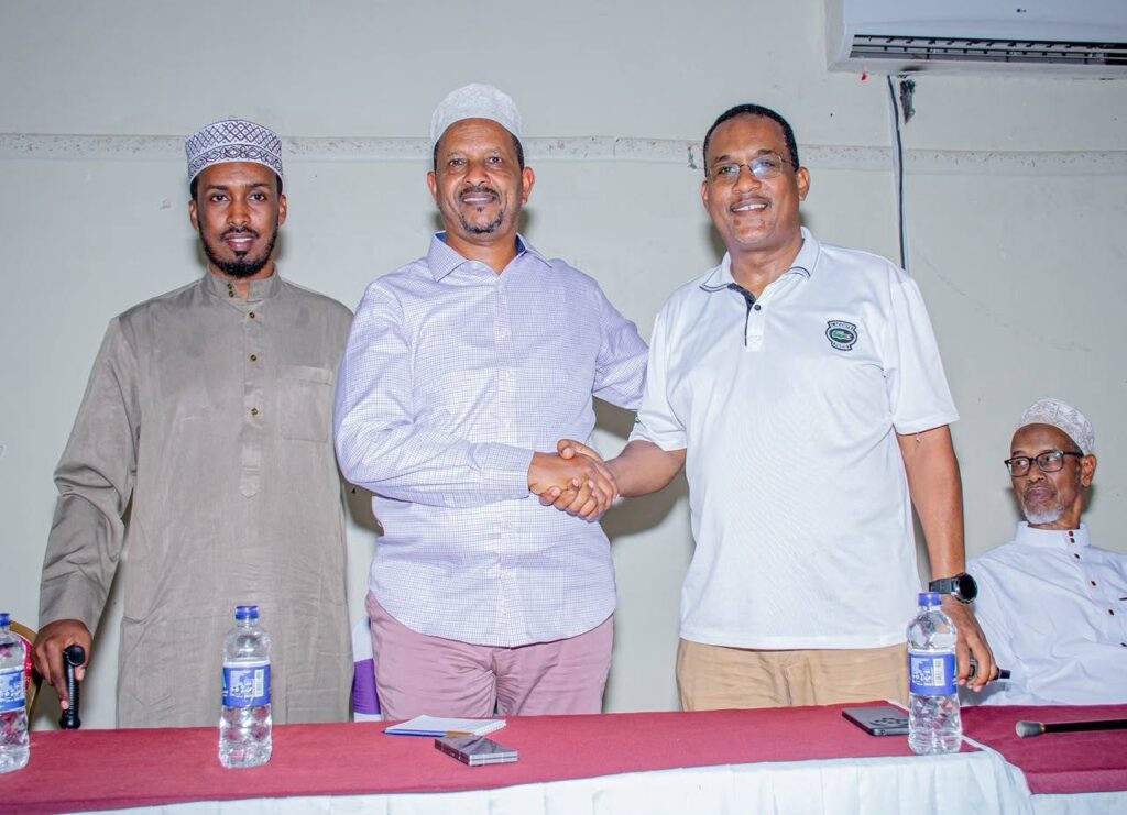 Major (Rtd) Dekow Mohamed Barrow and former Balambala MP Dr. Abdikadir Omar Aden shake hands following a family consensus meeting in Garissa, where Dr. Abdikadir announced his withdrawal from the 2027 parliamentary race. | Photo: ASAL POST
